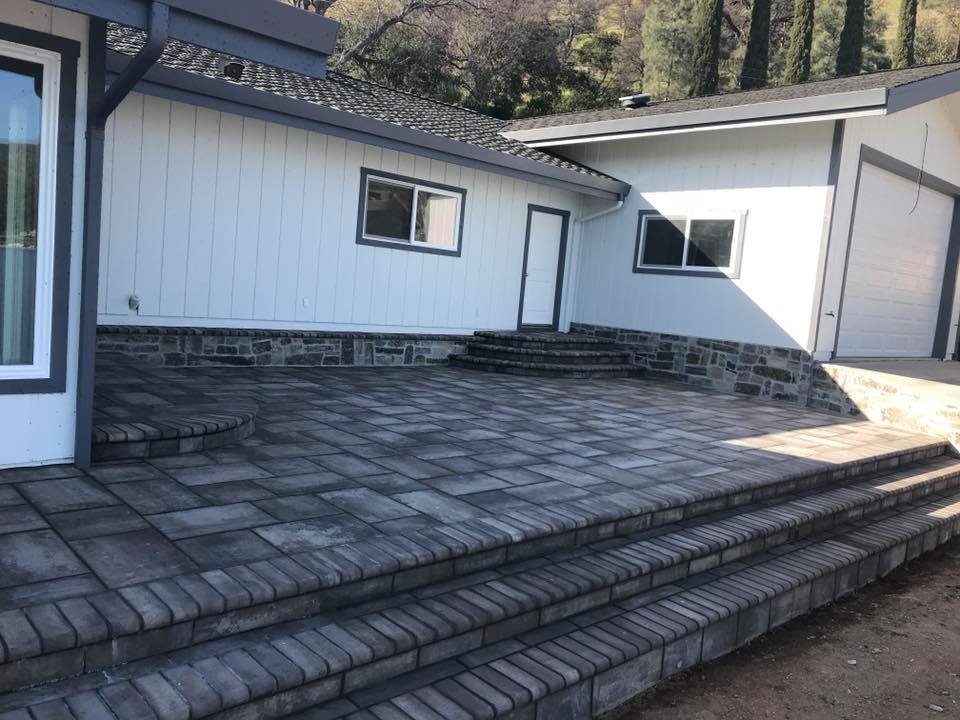 A house with steps leading to the front of it.